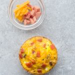 Low Carb Ham and Cheddar Cheese Egg Cups - a quick and easy grab and go breakfast for busy mornings. Simple to customize, keto friendly and full of protein.