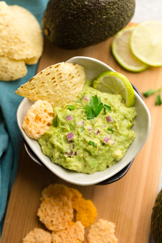 Low Carb Guacamole - this homemade recipe is the perfect party dip and keto, paleo and Whole 30 snack. Pairs perfect with fajitas, salads or by the spoonful.