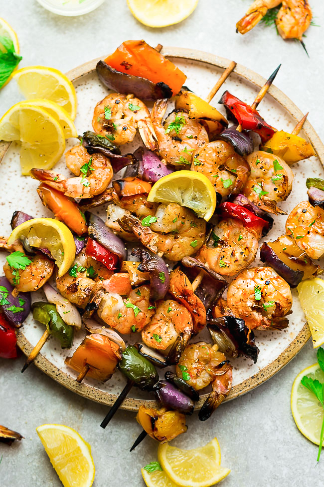 Grilled Lemon Shrimp Skewers with Vegetables coated with a buttery garlic lemon sauce. Low carb, keto and perfect for patio season.
