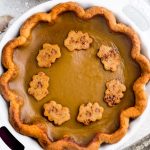 A delicious low carb pumpkin pie recipe with all the delicious flavors of a traditional pumpkin pie. Made with a flaky and buttery crust with a smooth and creamy Paleo-friendly custard filling with cozy fall spices.