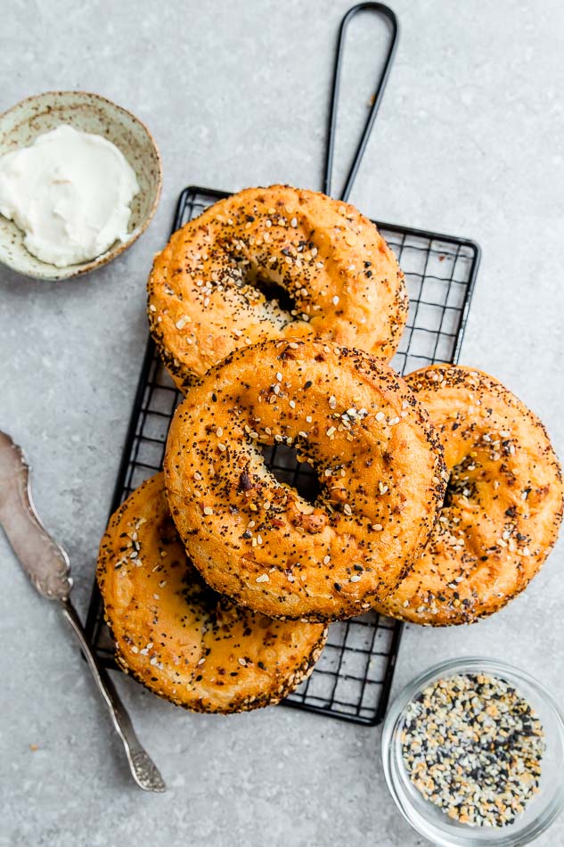 Top view of 4 low carb everything bagels on a wire rack