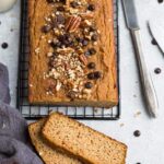 Top view of keto pumpkin bread on a grey background
